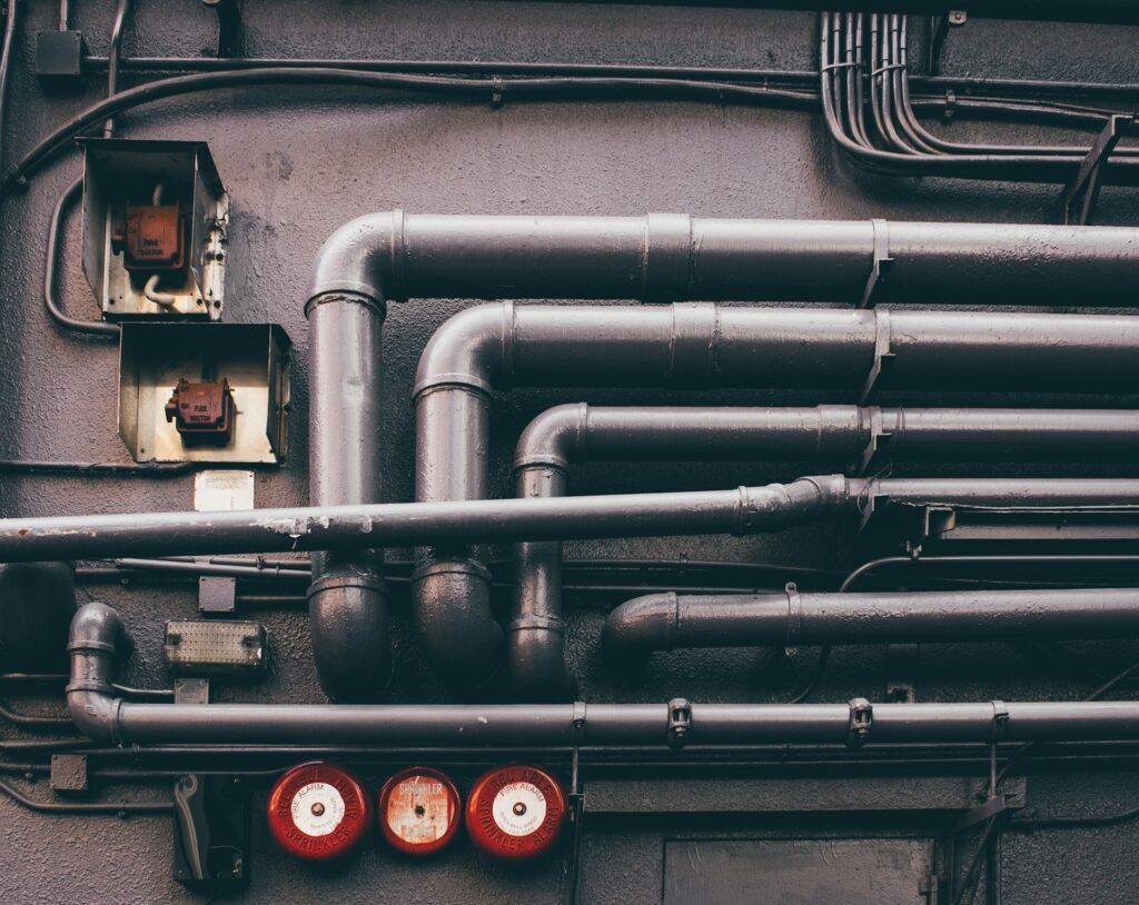 The Dangers of Drinking Lead Contaminated Water, Lead Pipes on the side of a building