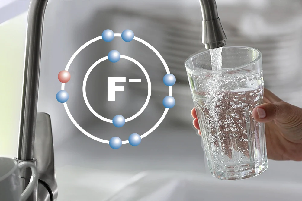 Risks of Fluoride in Drinking Water, a glass of water being filled up at a tap, next to the chemical symbol of fluoride.