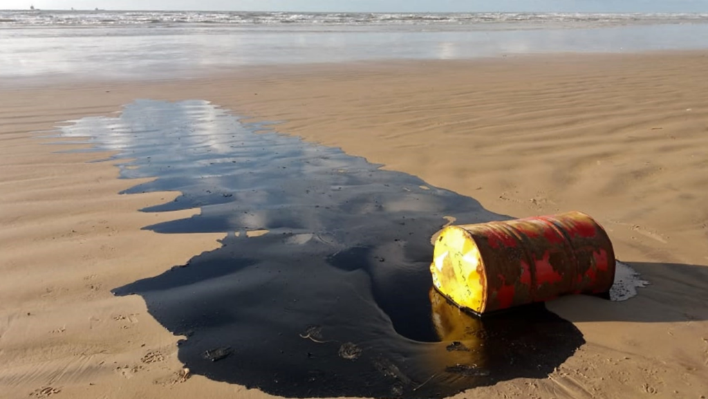 How do we Clean Up Oil-spills? A leaking oil barrel on a beach